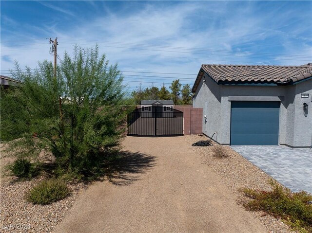 view of side of property with a garage