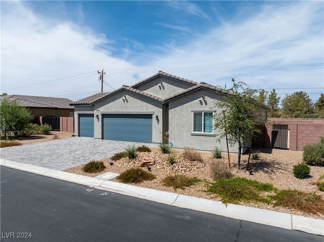 ranch-style house featuring a garage