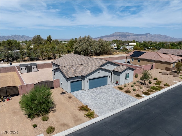 view of front of house with a mountain view and a garage