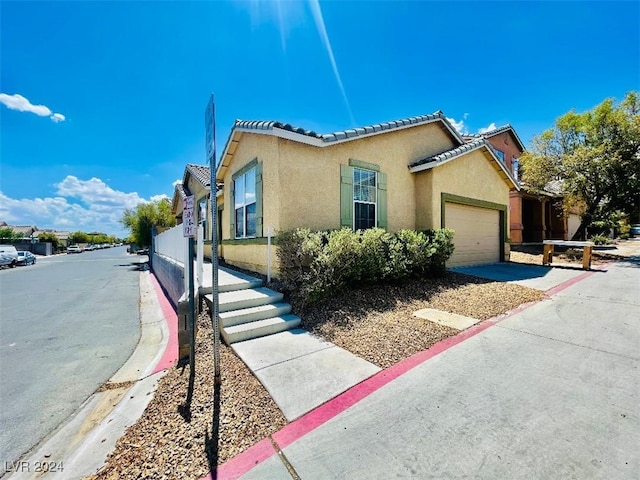 view of property exterior featuring a garage