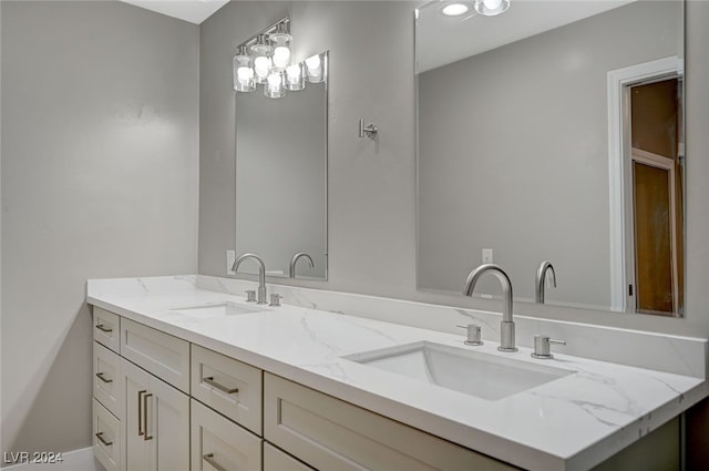 bathroom with double vanity and a sink