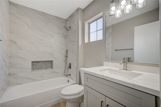 bathroom featuring shower / bath combination, vanity, and toilet