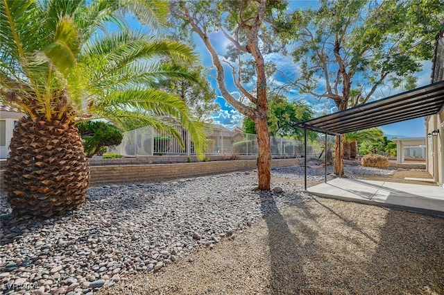 view of yard featuring a patio area and fence