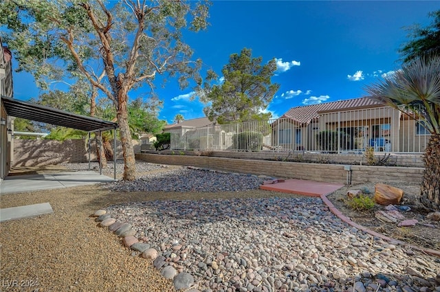 view of yard featuring fence and a patio