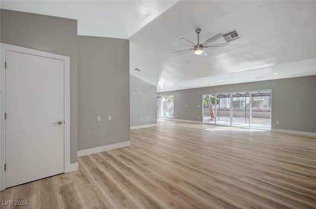 unfurnished living room featuring light wood-type flooring, visible vents, and baseboards