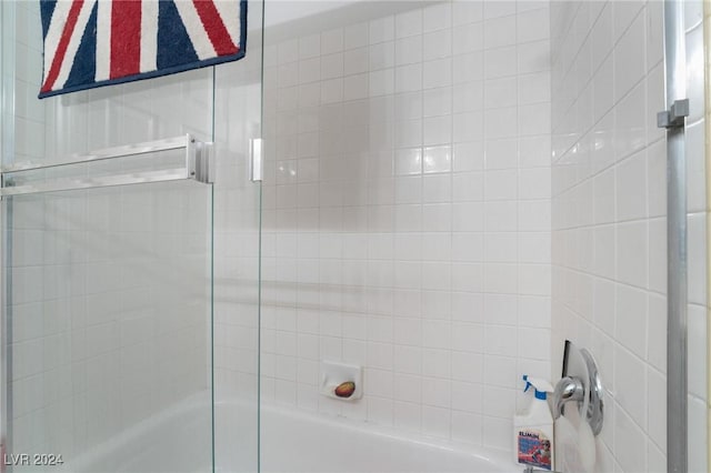 full bathroom featuring shower / bath combination with glass door