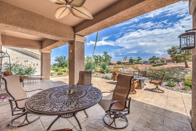 view of patio / terrace with outdoor dining area and a ceiling fan