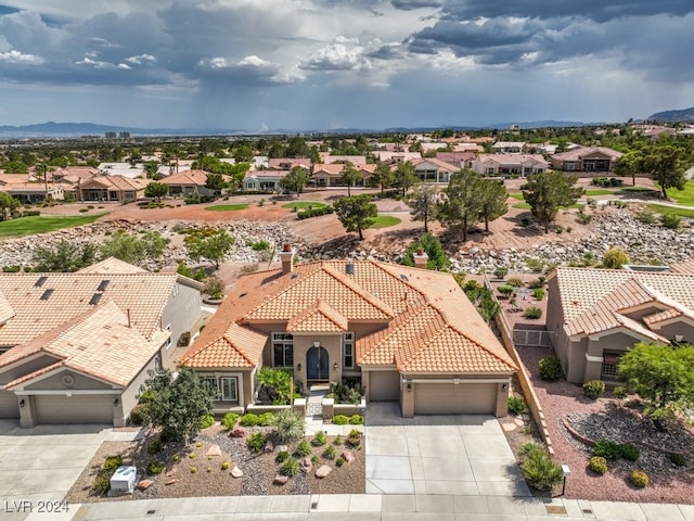 birds eye view of property with a residential view and a mountain view