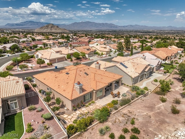 drone / aerial view featuring a residential view and a mountain view