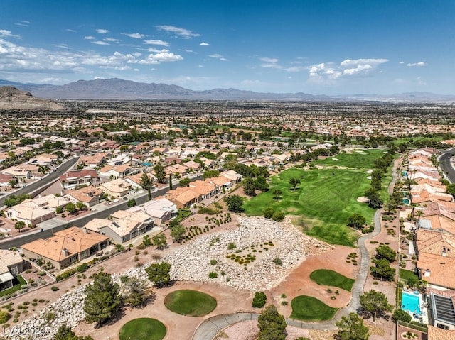 aerial view with view of golf course, a residential view, and a mountain view