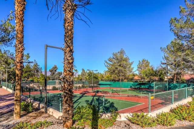 view of sport court with fence