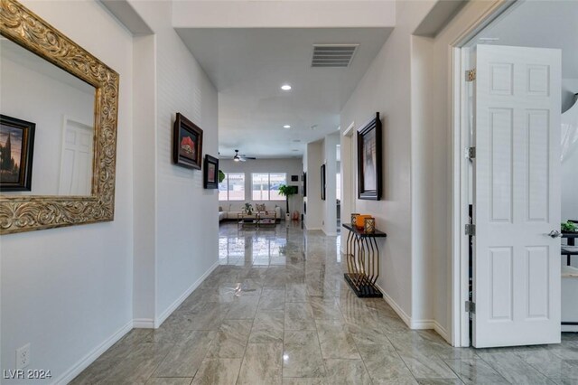 hallway featuring light tile patterned flooring