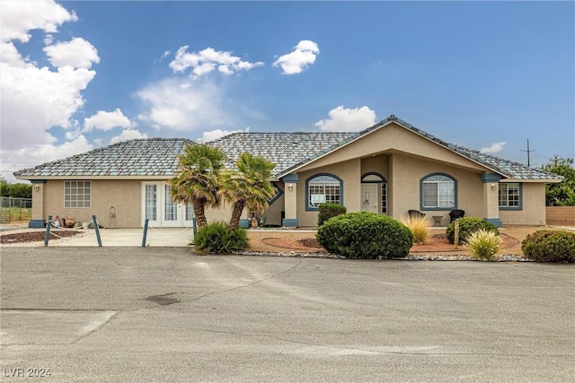 ranch-style home with a patio area