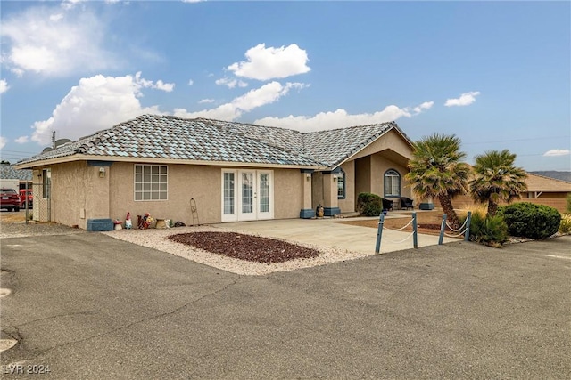 view of front of property featuring french doors and a patio area