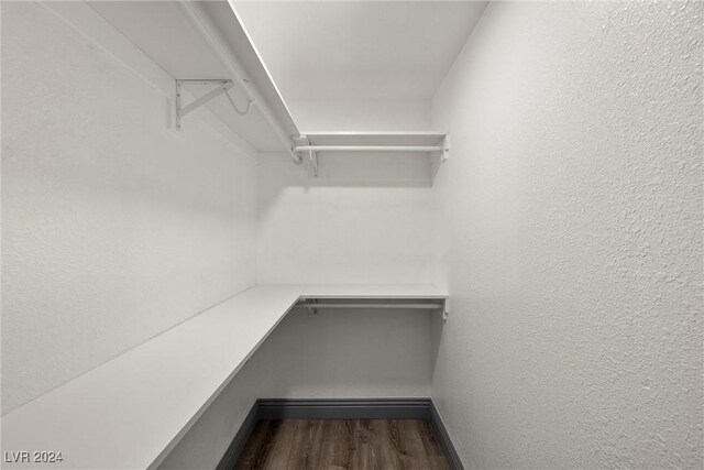 spacious closet featuring hardwood / wood-style flooring