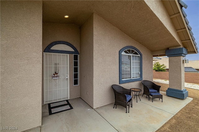 doorway to property featuring a patio area