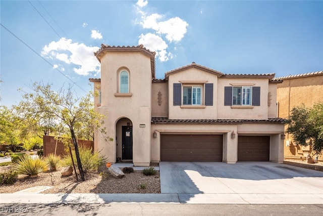 mediterranean / spanish-style house featuring a garage