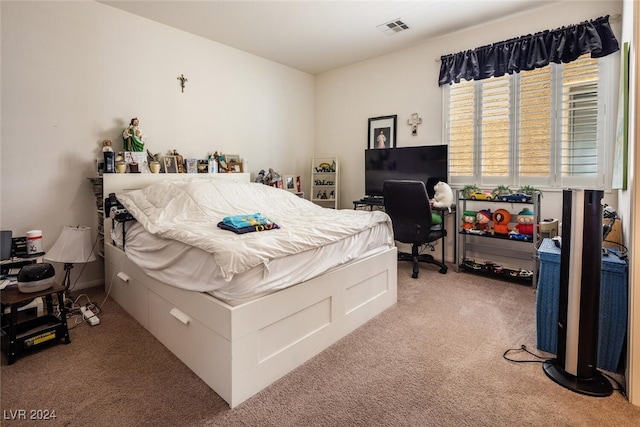 bedroom featuring light carpet