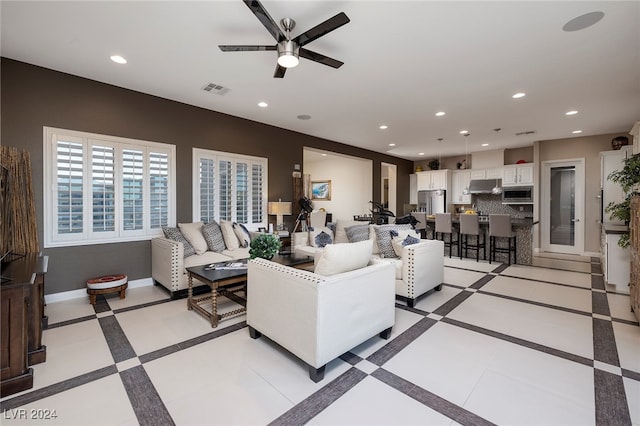 living room with ceiling fan