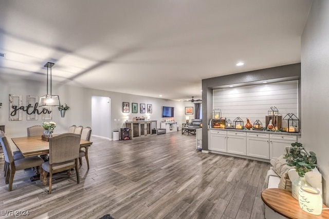 dining space with hardwood / wood-style flooring