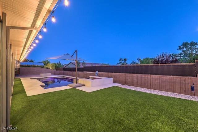 view of yard featuring a pool with hot tub and a patio area