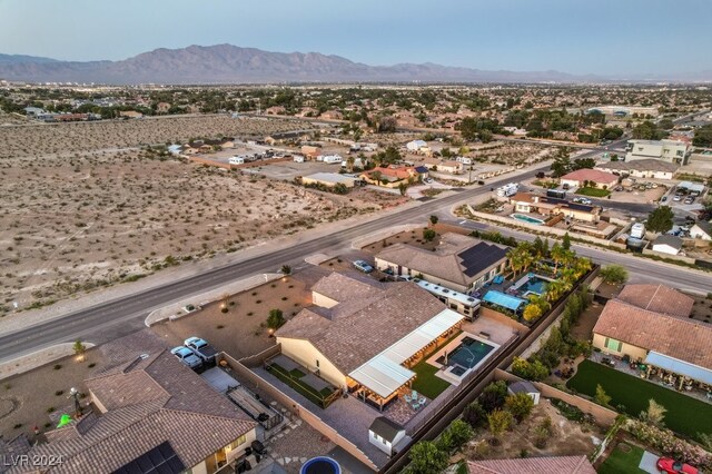 birds eye view of property with a mountain view