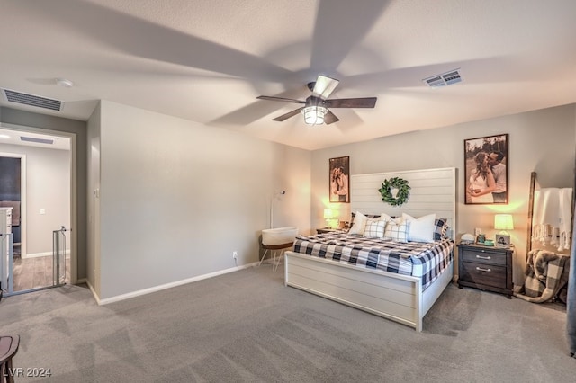 bedroom featuring ceiling fan and carpet