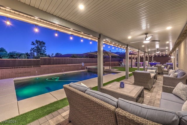 view of swimming pool featuring an outdoor hangout area, a patio, and ceiling fan