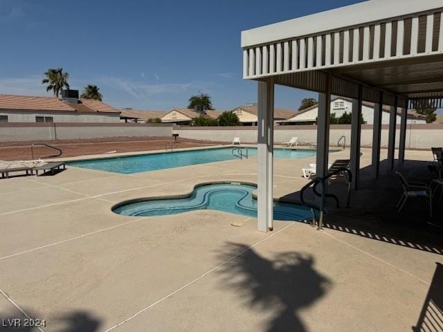 view of swimming pool with a patio