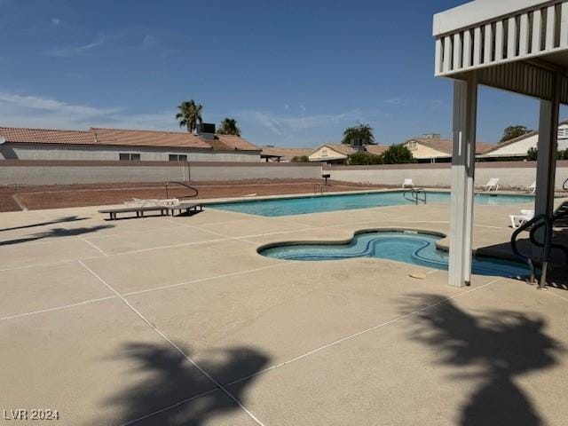 view of swimming pool featuring a patio area