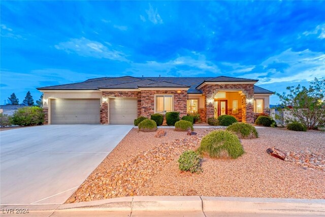 prairie-style home featuring a garage