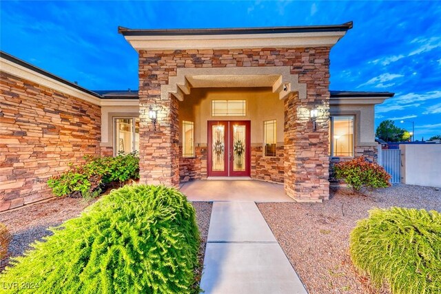 exterior entry at dusk with french doors