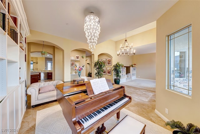 miscellaneous room with light tile patterned floors and an inviting chandelier