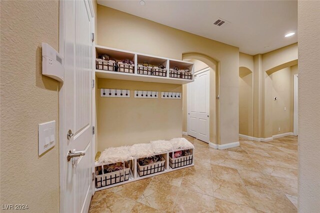 mudroom featuring light tile patterned floors