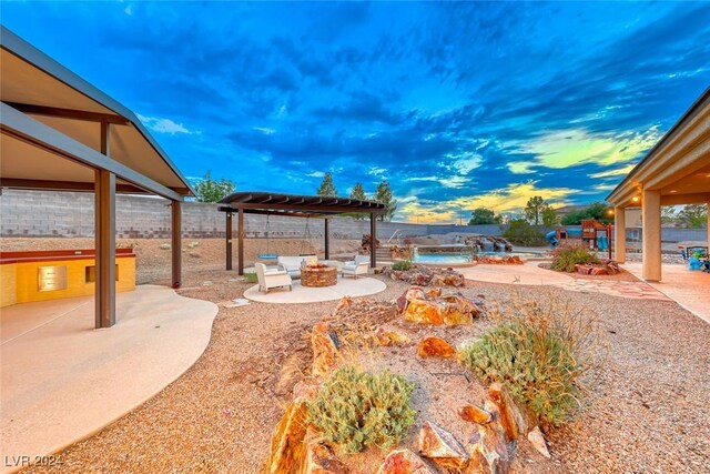 yard at dusk with a patio