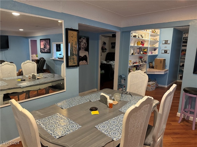 dining room with wood-type flooring