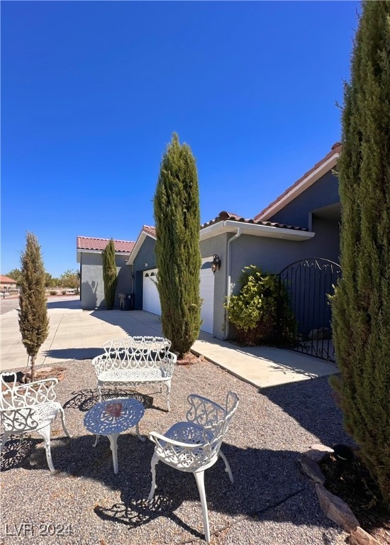 view of patio / terrace with a garage