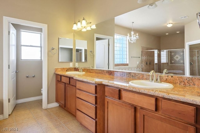 full bathroom featuring toilet, vanity, a notable chandelier, plus walk in shower, and tile patterned flooring