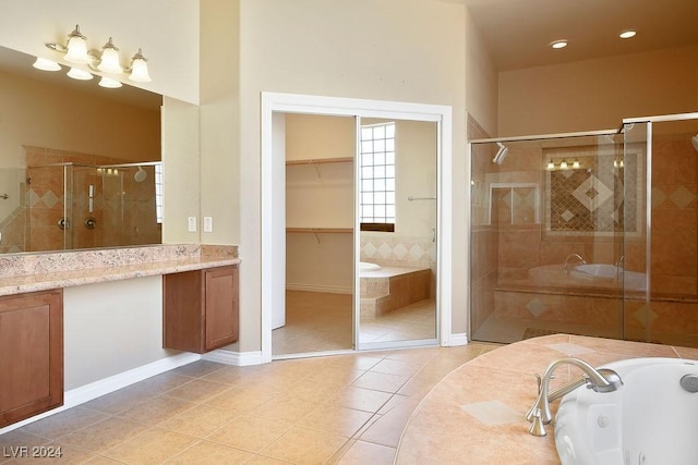 bathroom featuring vanity, tile patterned floors, and plus walk in shower