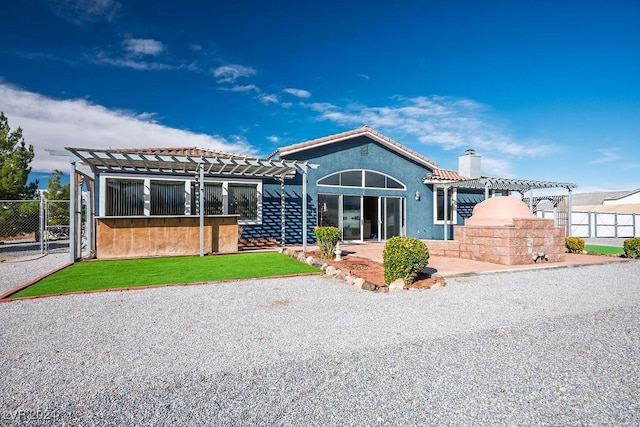 view of front of house featuring a pergola