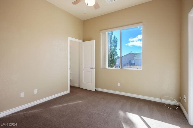 carpeted empty room with ceiling fan