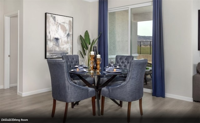 dining space featuring hardwood / wood-style flooring