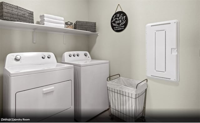 clothes washing area featuring washer and dryer