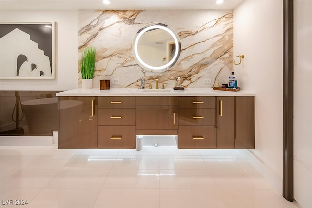 bathroom featuring backsplash and vanity