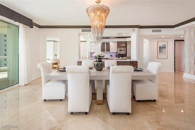 tiled dining space with a notable chandelier and ornamental molding