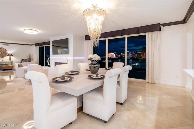 dining space featuring light tile patterned flooring, a chandelier, and ornamental molding