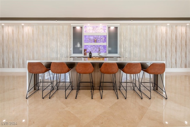 bar featuring light tile patterned floors