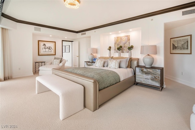 bedroom featuring crown molding and light colored carpet