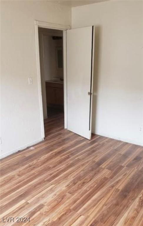 spare room with hardwood / wood-style floors