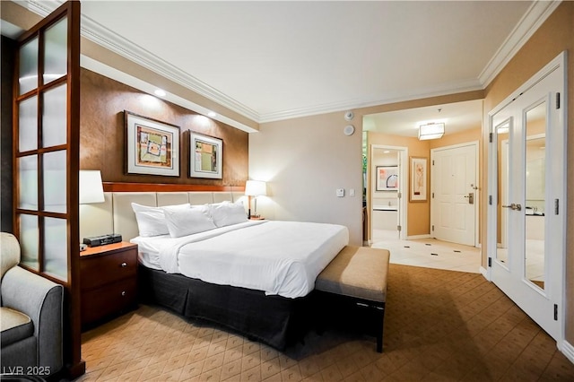 bedroom with baseboards and crown molding